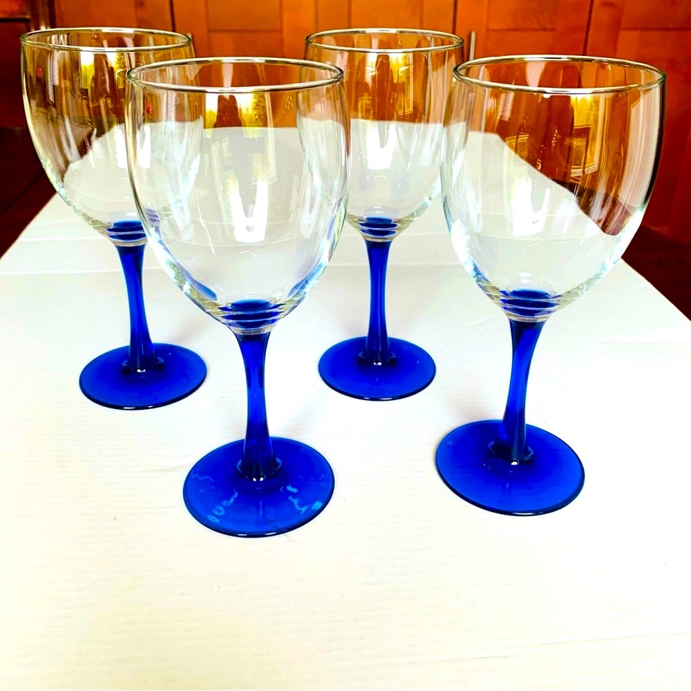 Set of four 7” in tall glasses with cobalt royal blue glass stem wine glasses